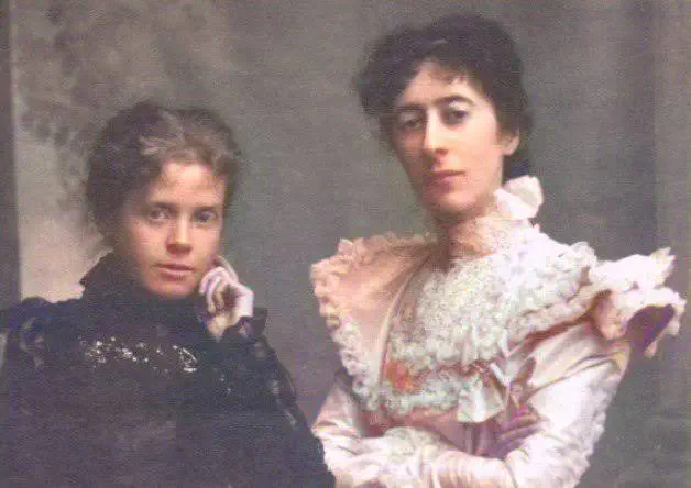 Ethna Carbery, at right, seated beside another woman